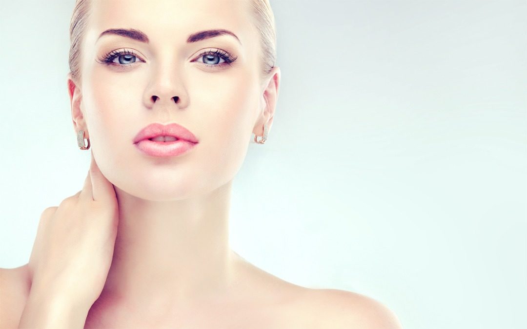 Beautiful Young Woman with Clean Fresh Skin close up . Skin care